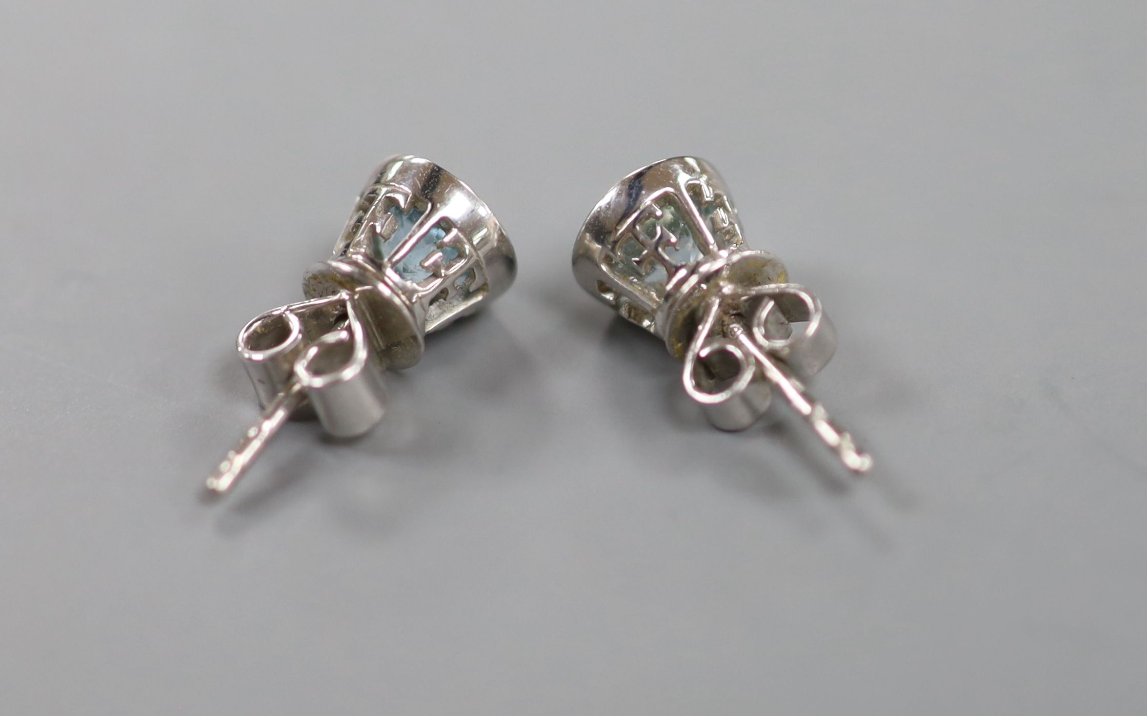 A cased modern pair of Theo Fennell 18ct white gold and blue topaz set ear studs